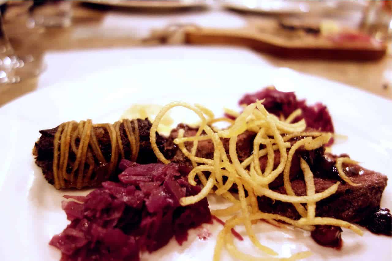 Strips of kangaroo meat, served with crispy potato noodles, red cabbage slaw and Illawara Plum jus.